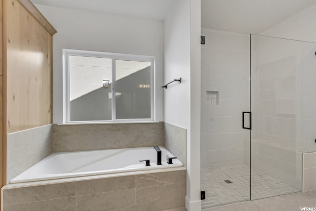 bathroom with independent shower and bath