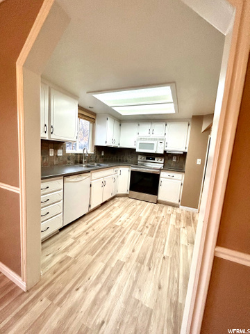 **NEW FLOORING & PAINT, UPDATED CABINETS