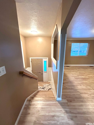 **NEW FLOORING, BRIGHT ENTRY LIGHT**