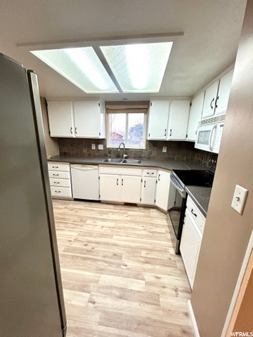 **NEW FLOORING & PAINT, UPDATED CABINETS