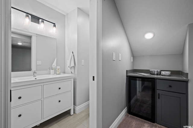 Basement bathroom off family room. Under stairs ba