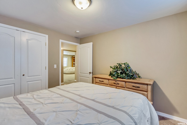 LOWER LEVEL BEDROOM #1 WITH DOUBLE CLOSET