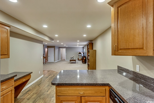 LOWER LEVEL KITCHEN WITH VIEW TO FAMILY ROOM