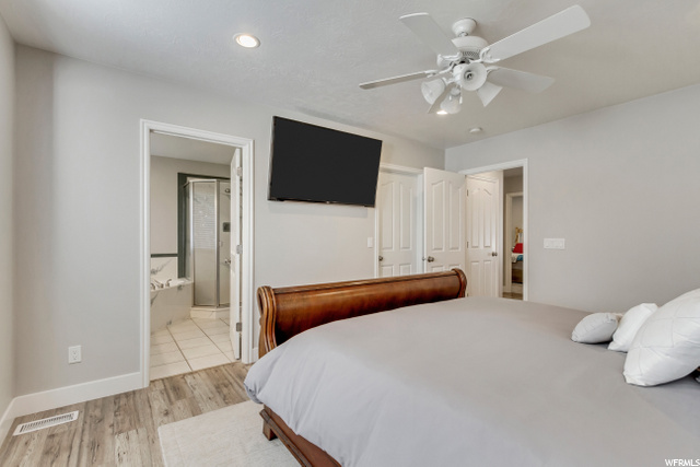 MASTER BEDROOM WITH WOOD FLOORING