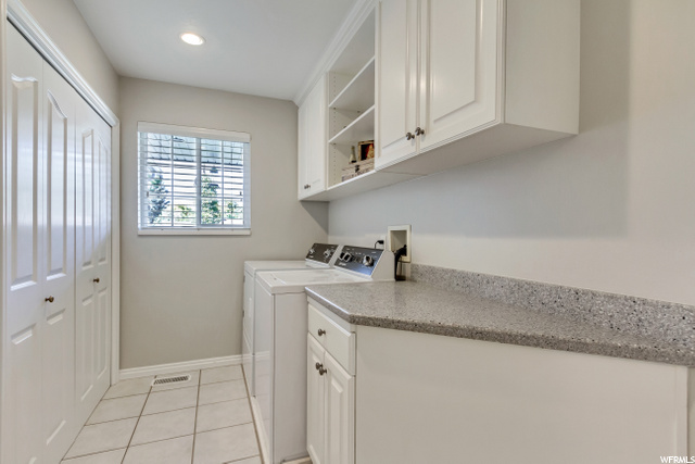 MAIN FLOOR LAUNDRY WITH WINDOW  & CUSTOM CLOSET