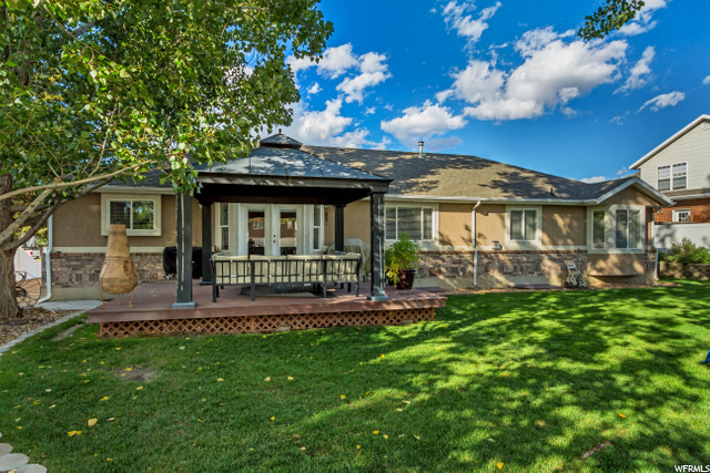 BACK  VIEW OF HOME, DECK, GAZEBO AND YARD