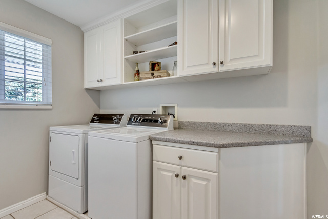 MAIN FLOOR LAUNDRY WITH TILE FLOORING