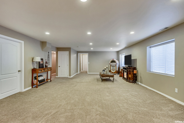 LOWER LEVEL FAMILY ROOM WITH LOTS OF  WINDOWS AND