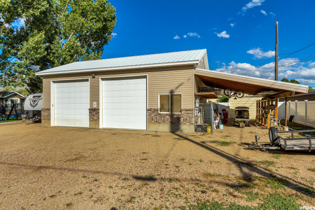 HUGE GARAGE WITH ATTACHED CARPORT