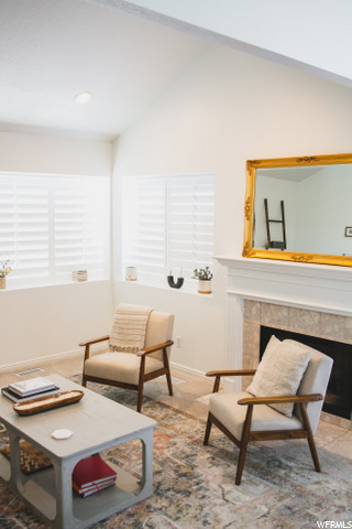 gas fireplace in entry with tall ceilings