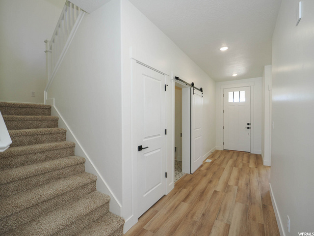 doorway to outside featuring wood-type flooring