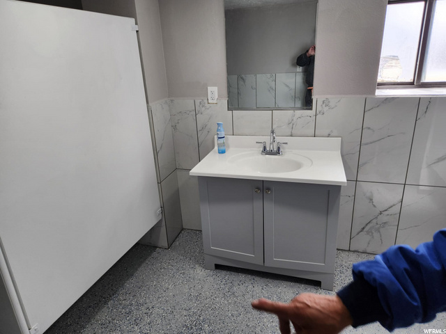 bathroom featuring vanity and mirror