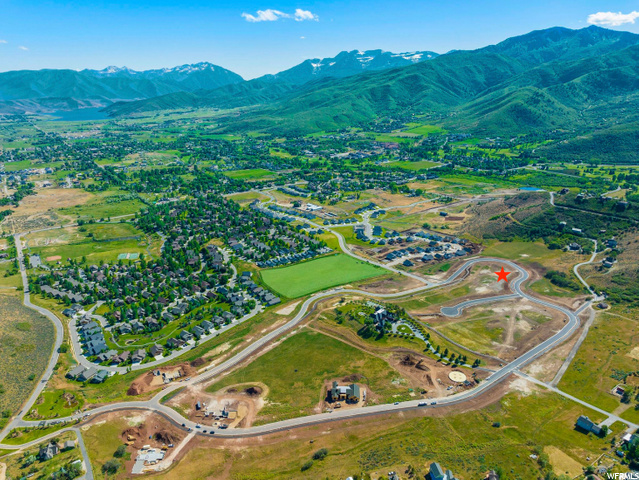 Lot #14 The Reserve is a fully designed and planned community consisting of 48 custom estate homesites surrounded by 30 acres of lush open space. Signature amenities include miles of walking trails, waterfalls, sports court, pool, viewing deck, and family gathering places. This breathtaking location boasts panoramic views of historic farms, Snake Creek Canyon, Deer Creek Reservoir, and the majestic Mount Timpanogos, while providing the exclusivity and serenity one desires in luxury living. This lot faces south with a view of the valley and mountains all surrounding Midway and Heber.  The seller has custom plans available for an additional fee already completed for this lot and view.  Topographical survey is also available.