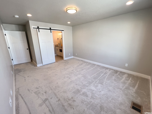Master Bedroom w/Sliding Door to Bathroom