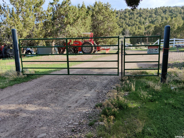Gated entrance to 5 acre parcel on east.
