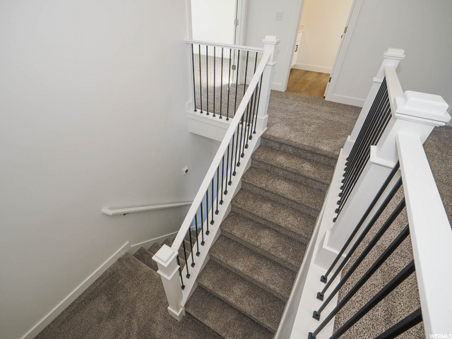 stairs with wood-type flooring
