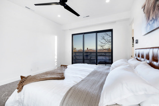 Primary bedroom with balcony