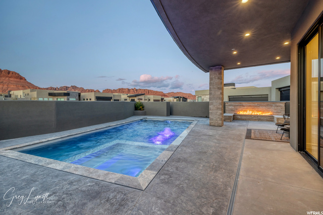 Pool and fire pit at dusk