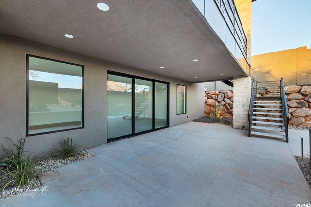 stairwell to upstairs balcony as well as pool and