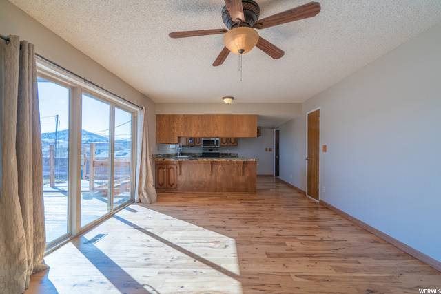 Large living/dining space off kitchen with access