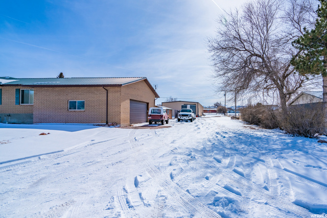 Long large driveway with garage on side of home