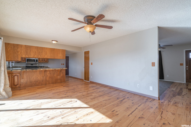 Large living/dining space off kitchen with access