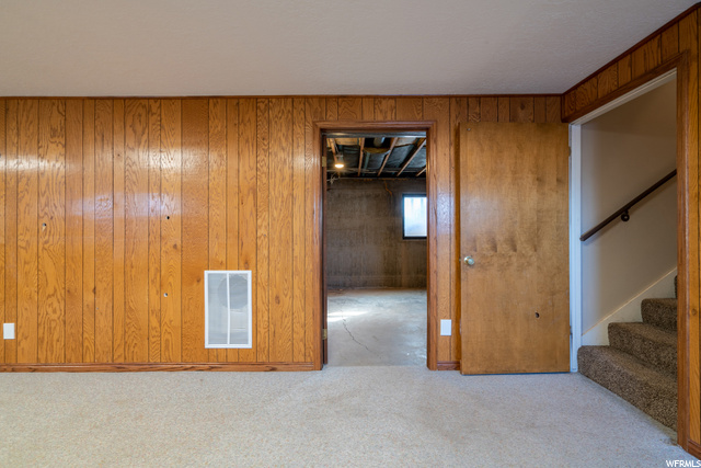 Basement leading to unfinished areas and storage