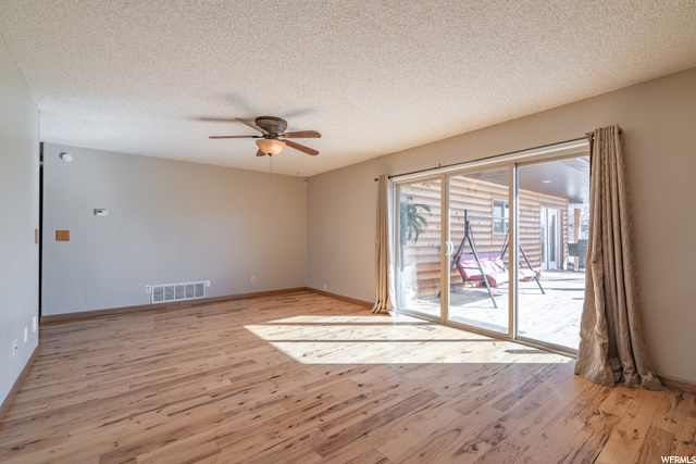 Large living/dining space off kitchen with access