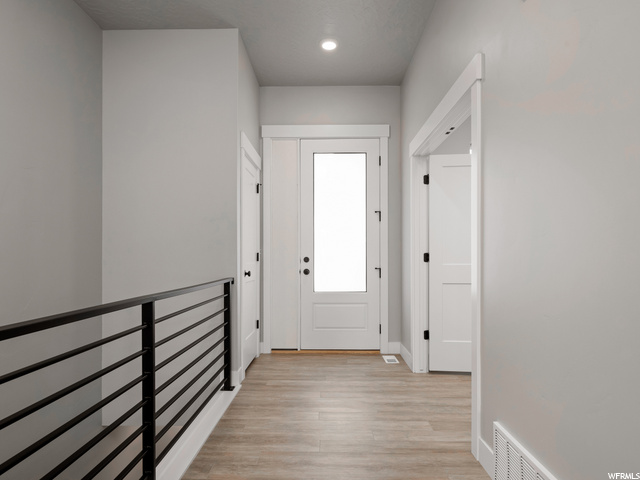 corridor featuring hardwood floors