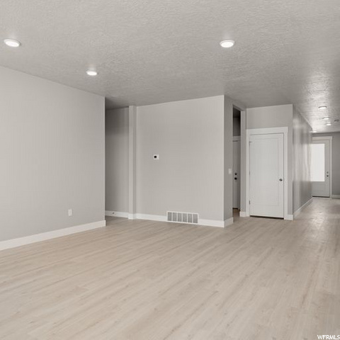 empty room featuring hardwood floors