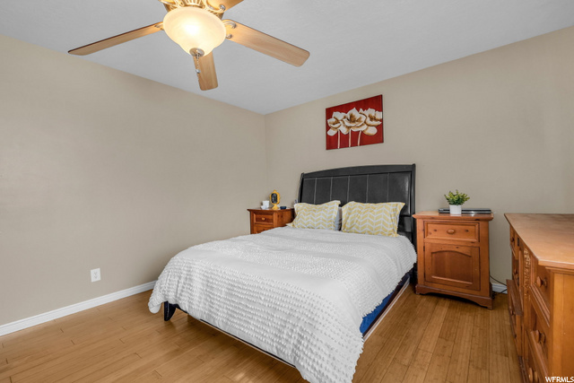 bedroom with a ceiling fan and hardwood floors