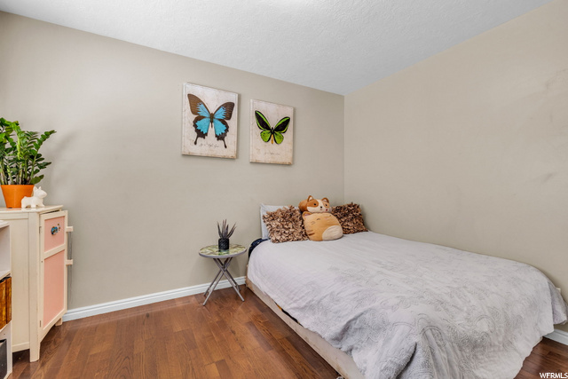 bedroom with hardwood flooring
