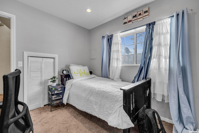 carpeted bedroom featuring natural light