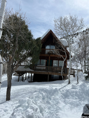 Looking for your own slice of paradise? Look no further than this fully remodeled cabin located in Tabiona, Utah. This stunning property at the end of a cul-de-sac boasts .44 acres of beautiful Utah land with no backyard neighbors due to a mountain behind the house where no one can ever build and features a completely updated interior that is sure to impress. Step inside and you'll immediately notice the attention to detail that has gone into every aspect of this cabin. From the new electrical and plumbing to the new roof, flooring, kitchen, and appliances, every inch of this home has been carefully updated to provide the ultimate in comfort and style. There are 9' ceilings on the main level and the upper-level features high vaulted ceilings. This cabin was designed to balance rustic aesthetic with a modern flair. This cabin is perfect for anyone looking for a quiet retreat in the mountains. With high- speed internet, you can stay connected to the outside world while still enjoying the peace and tranquility of your surroundings. Whether you're looking for a permanent residence or a weekend getaway or you want to start renting short term for extra income, this cabin is sure to meet your needs. Located high on Mt. Tabby at an elevation of 7500', this property is just a 1.5 hour drive away from Salt Lake or an hour from Park City. Wildlife including moose, deer, elk, owls, and turkeys are often seen and heard and recreational trails are right out the front door. Adjacent .44 acre lot is also for sale with an extra water right. Cabin comes fully furnished with the right offer (everything is brand new and top of the line). Short term rentals are allowed.