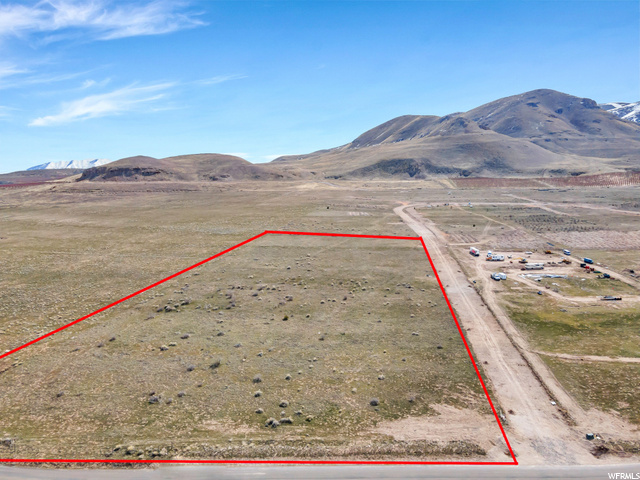 Remarkable 5 acre plus buildable property including water rights. Un-obstructed views of Utah Lake, and the Wasatch Mountain Range looking north. Enjoy privately deeded beach front property with Bayview subdivision. Homes are currently under construction in the community with several lots meeting approval including this one. You could be the next to be part of something special in this quiet lake side community. Contact agent to begin designing your dream home with builder.  Information provided deemed reliable but not guaranteed.  5600 S Lincoln Beach Rd is the approx. address. County has not yet assigned the parcel an exact address. Google "Lincoln Beach Boat Harbor", drive approximately 2 miles southwest. There is a sign on property. Call with questions.