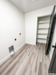 Laundry room with linen closet