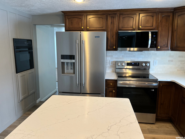 Kitchen Photo w/ new stove and microwave