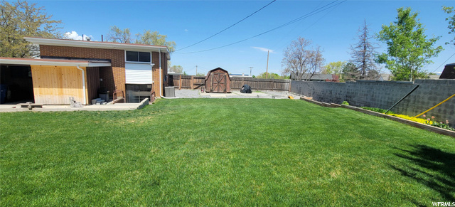 large yard with sheds