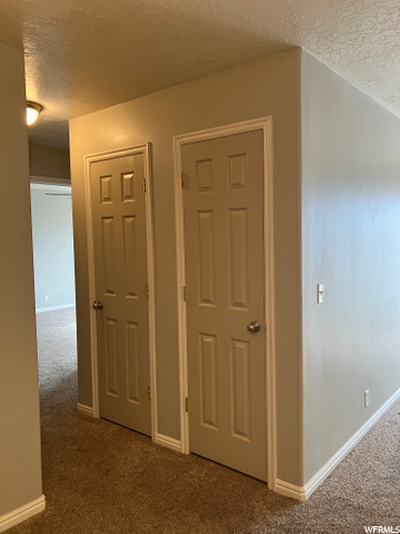 Hall with coat and linen closets
