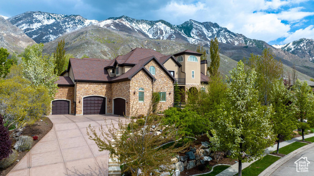 A true "one of a kind"  home now available in the prestigious Alpine market! This beautiful home sits on the east bench of Alpine cove, overlooking Utah county. With almost an acre of mature trees and mountain views, this west facing home will offer plenty of cool summer nights to enjoy and relax with friends and family. Features include: heated driveways and sidewalks, 5 car garage, 10,900+ square feet of living space, mother in law apartment, theater room, and much much more. This is a home that you wont wanna miss. Call or text for a personal tour!