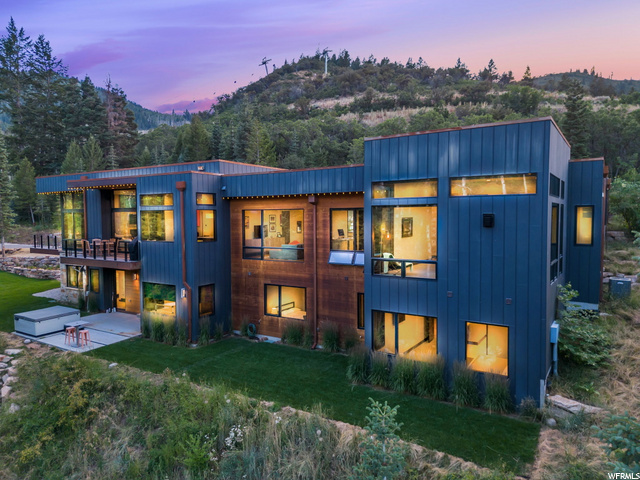 This ultra-private gated ski home sits on a seasonal creek and is surrounded by a forest of mature pines and aspens! Located on over 5 acres in the exclusive White Pine Ranches community, enjoy rare and direct access at the base of Tombstone and Timberline Ski lifts. This Jaffa Group-designed home features floor-to-ceiling glass windows that bring in its surroundings and connect you with this one-of-a-kind setting. Entertain with family and friends and take advantage of an open floor plan, gourmet kitchen, and multiple outdoor spaces that seamlessly connect for true indoor-outdoor living. The owner's suite is tucked away on the main level, next to an office, offering main-level living. Additional amenities are a second family/media room, wet bar, wine cellar, luxurious guest suites, 3 car garage, a backyard with a hot tub, built-in trampoline, and a large lawn. Feel remote as if you were the only home surrounded by nature and wildlife yet only minutes to Park City's historic Main Street for exclusive shopping and dining, 30 minutes to Salt Lake City International Airport and two FBOs, KSLC and KHCR.