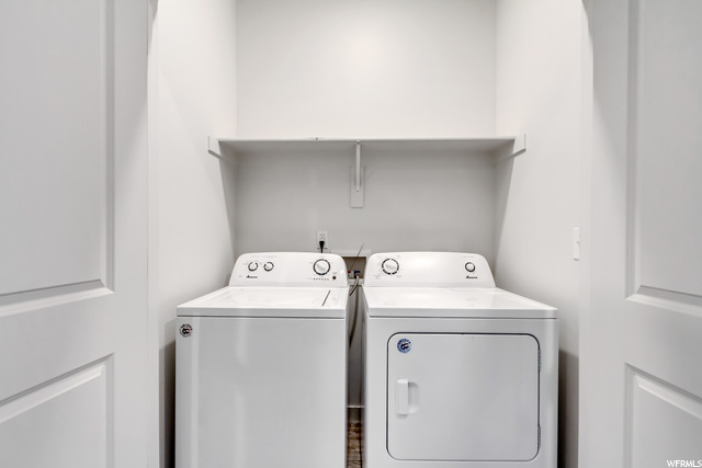 Laundry room with included washer and dryer