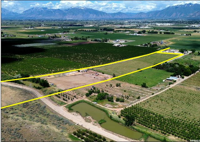 16.27 acres located within the growth path of Payson, Utah. Zoned RA-5 (Res-Agricultural 5-Acre Min) in Utah County. 19 feet of frontage on 2900 W (250 feet needed to develop). Parcel #29:013:0031 (2022 taxes: $117.40). 28.36 shares of Strawberry Valley Project water through Highline Canal, CUP water (rented). 10 acres irrigated with wheel lines. Farm yields: Silage corn: 24 ton/acre, Alfalfa: 5-7 ton/acre. Utilities in area: power, well water, dominion gas, & septic. Corrals located on the western edge of property. 12 miles southwest of Provo, Utah. 45 miles south of Salt Lake City, Utah.