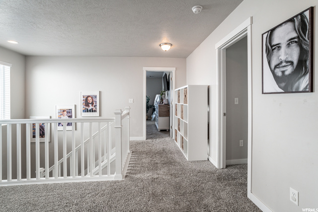 Hallway with carpet