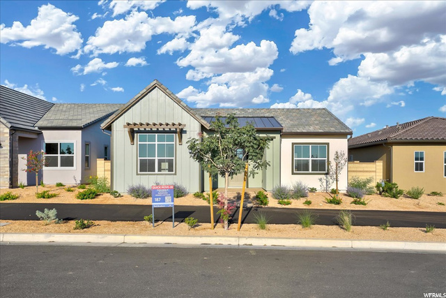 View of front of home featuring solar panels