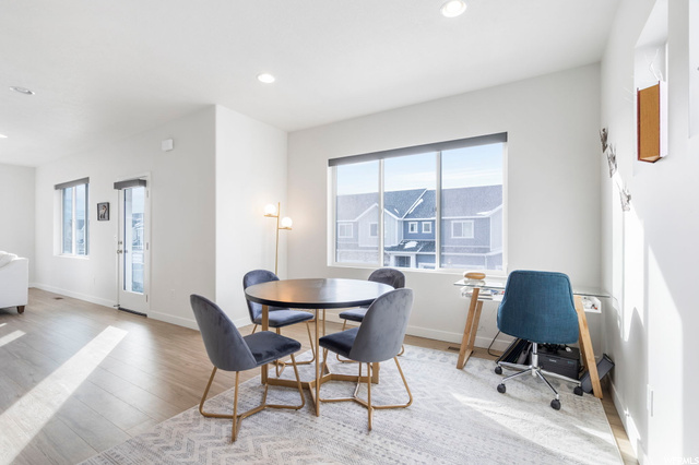 Dining area with light parquet floors