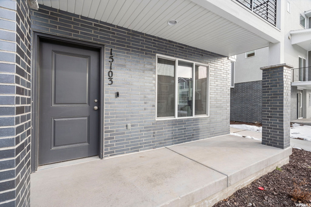 Property entrance featuring balcony