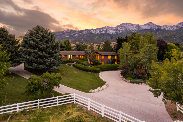 Experience pure paradise in Alpine, Utah! Nestled on 4.29 acres of exquisite horse property, this captivating treasure seamlessly blends rich history, tranquil serenity, and awe-inspiring natural beauty. As you drive up the welcoming lane, embraced by picturesque horse fencing, an immediate sense of timeless calm envelops you, setting the tone for this extraordinary estate. Behold breathtaking panoramic mountain views that unfold before your eyes,  a mid-century modern residence, a testament to passion and craftsmanship, where history finds a vibrant new life. Crafted to embrace cherished gatherings,  its inviting warmth and charisma infuse each and every corner. This property is a living piece of Alpine's storied heritage, a rare relic from a bygone era. Its roots trace back to the original owners who discovered Alpine's unparalleled tranquility and prestige long before it earned its acclaim. Their enduring spirit is etched into every facet of this home. The allure is nothing short of enchanting. The palpable soul of the property welcomes you, extending an invitation to make it a part of your own story. This home is a wellspring of inspiration, where memories stretch across generations. It represents an investment in legacy, an opportunity to immerse yourself in the grandeur of Alpine's history. Don't miss out on this unparalleled experience. Embrace the enchantment!
