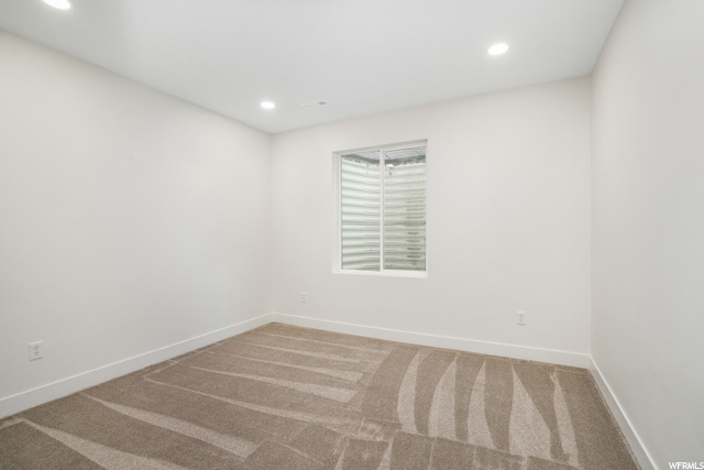 View of carpeted spare room