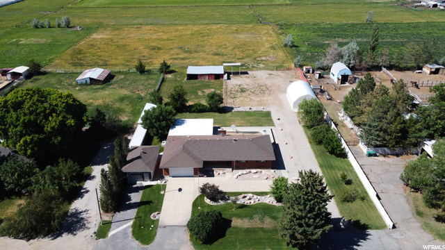 ** UNGODLY PRICE DROP ** 3 acres * Large RV Garage/Shop * Large Sunroom * HORSE PROPERTY * Single Level Living * 2 Car Attached Garage with extra length * 1 Car Detached Garage * Large Covered Patio * Inground Pool (to be restored) * Amazing West & East Mountain Views *